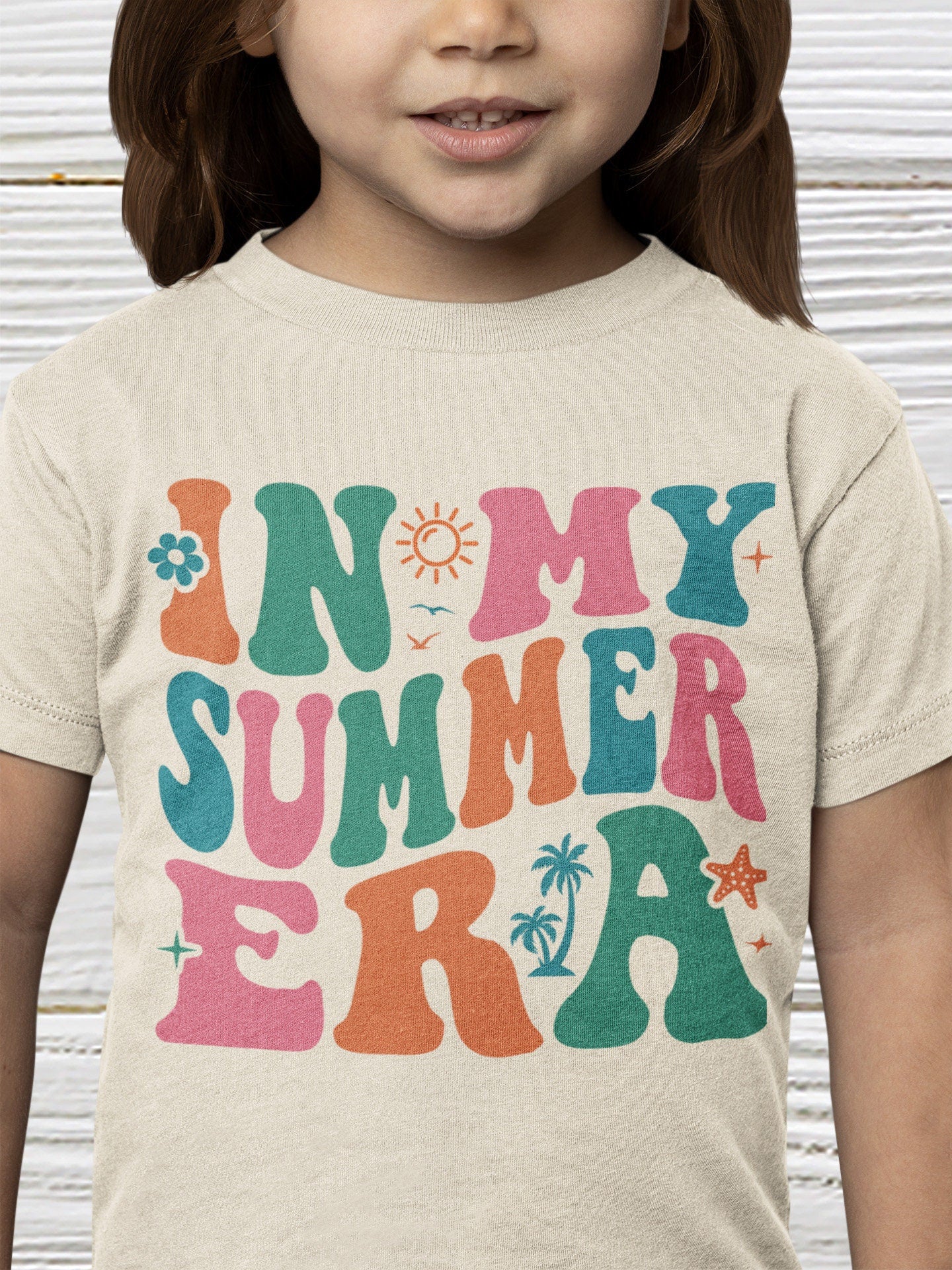 girl wearing summer t shirts sand 